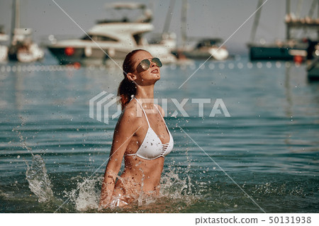 Vintage Bikini girl on the beach. woman in bikini Vintage Bikini girl on the beach. woman in bikini 50131938