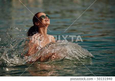 Vintage Bikini girl on the beach. woman in bikini Vintage Bikini girl on the beach. woman in bikini 50131940