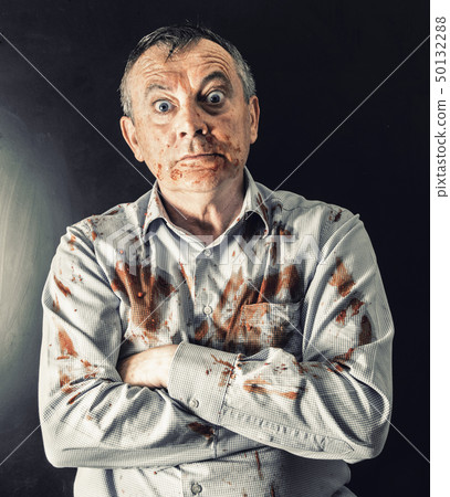 man dirty of tomato sauce 50132288