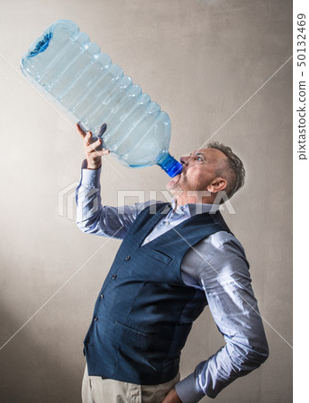 man  with a giant water bottle 50132469