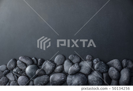 stacked stones on dark background stacked stones on dark background 50134256