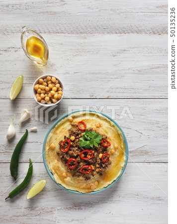 Creamy hummus with spicy mutton minced meat. Creamy hummus with spicy mutton minced meat. 50135236