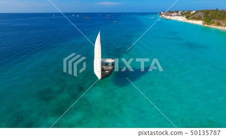 White sailboat in a sea traditional Dhow Zanzibar White sailboat in a sea traditional Dhow Zanzibar 50135787
