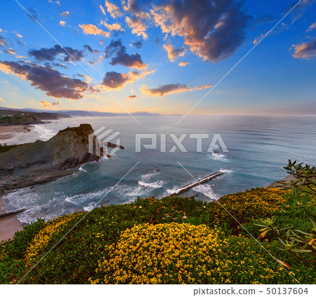 Spring sunset ocean coast. 50137604