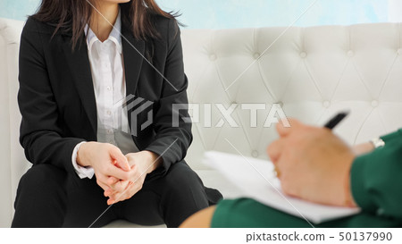 Therapy session: close up on nervous, anxious girl's hands. 50137990