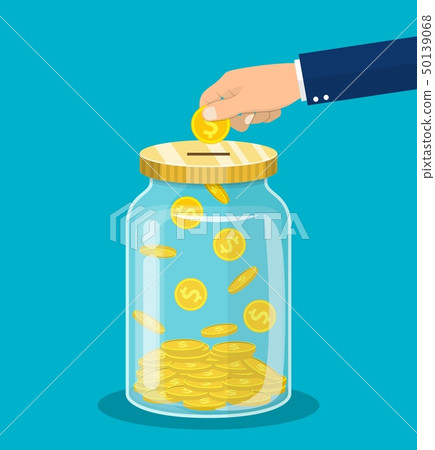 Hand throws a gold coin in the jar Hand throws a gold coin in the jar 50139068
