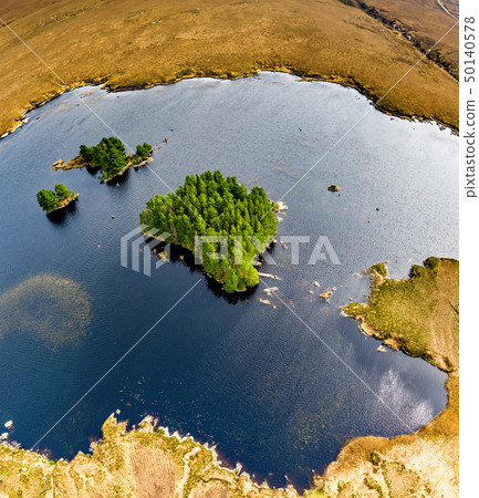 Aerial view of Loch Mhin Leic na Leabhar - Meenlecknalore Lough - close to Dungloe in County Donegal 50140578