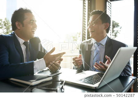 Business people working during lunch in cafe 50142287