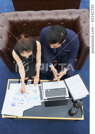 Business people analyzing business charts 50142785