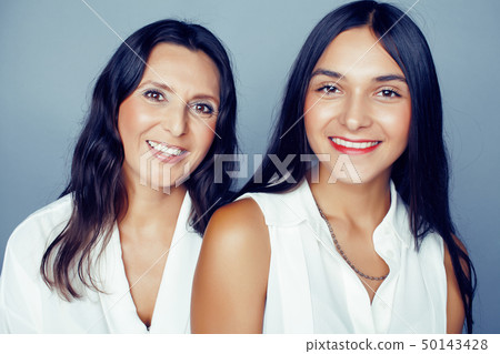 cute pretty teen daughter with mature mother hugging, fashion style brunette, lifestyle people cute pretty teen daughter with mature mother hugging, fashion style brunette, lifestyle people 50143428