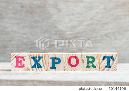 Letter block in word export on wood background Letter block in word export on wood background 50144196