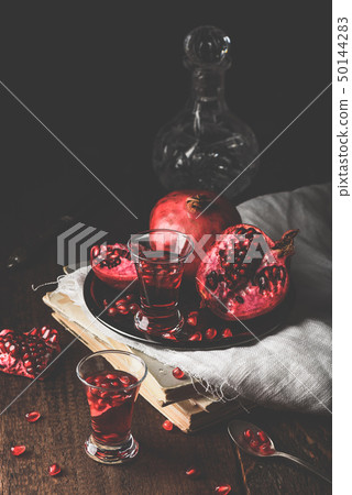 Shots of pomegranate liqueur Shots of pomegranate liqueur 50144283