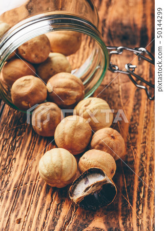 Whole and crushed dried limes on wooden table Whole and crushed dried limes on wooden table 50144299