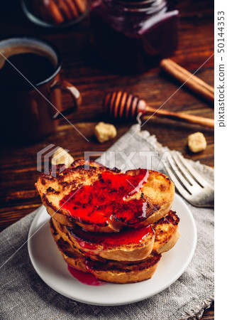 Stack of french toasts with berry marmalade Stack of french toasts with berry marmalade 50144353