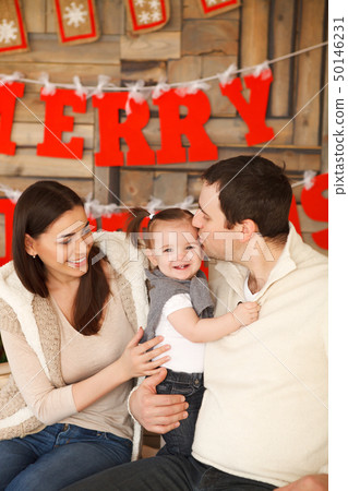 Happy family with near the Christmas background Happy family with near the Christmas background 50146231