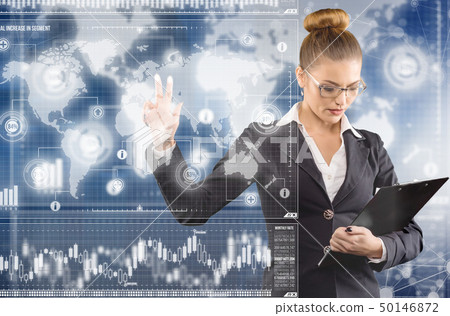 Young business lady works with virtual graphic interface in futuristic office 50146872