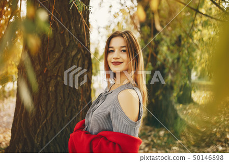 cute girl in a autumn park cute girl in a autumn park 50146898
