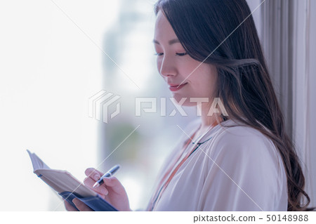 Office woman woman alone casual meeting 20s 30s business indoor pen notebook Office woman woman alone casual meeting 20s 30s business indoor pen notebook 50148988