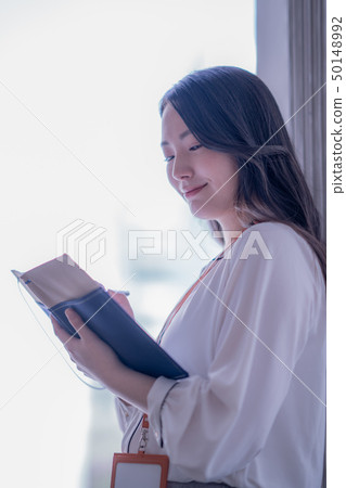 Office woman woman alone casual meeting 20s 30s business indoor pen notebook Office woman woman alone casual meeting 20s 30s business indoor pen notebook 50148992