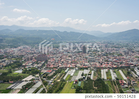 paragliding under blue sky in the town paragliding under blue sky in the town 50151428