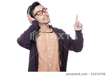 Happy asian man in brown jacket listening music Happy asian man in brown jacket listening music 50154798
