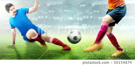 Asian football player man in blue jersey sliding Asian football player man in blue jersey sliding 50154874