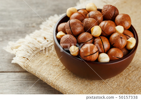 Macadamia nut on wooden background with vintage Macadamia nut on wooden background with vintage 50157338