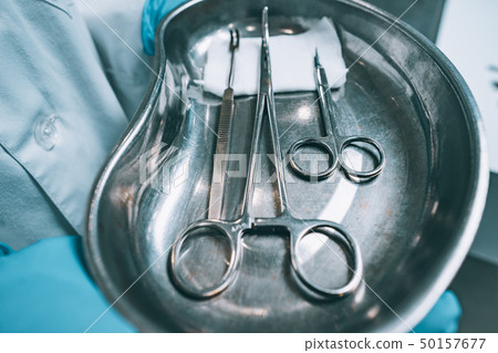 Several surgical instruments lie on a tray Several surgical instruments lie on a tray 50157677
