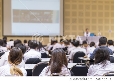 Speaker giving educational seminar blur background 50158323