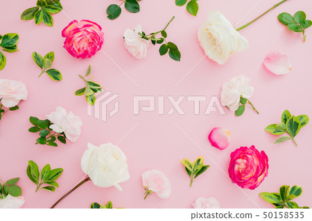 Floral frame with roses and leaves on pink Floral frame with roses and leaves on pink 50158535