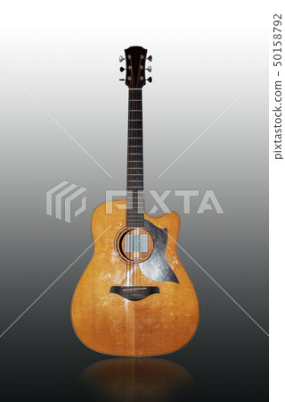 Split wooden guitar on a white background 50158792