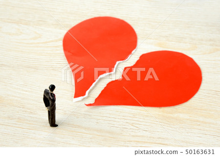 Businessman with a broken heart Businessman with a broken heart 50163631