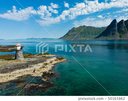 Gimsoy lighthouse on sea rocks, Lofoten Norway Gimsoy lighthouse on sea rocks, Lofoten Norway 50163862
