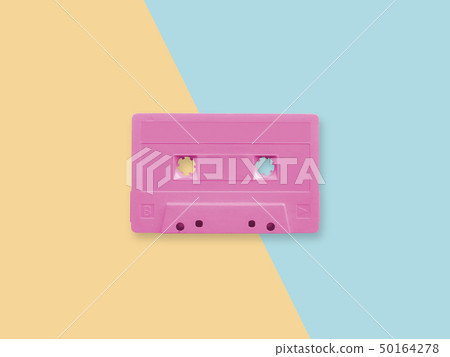retro pink cassette tape on a pastel duotone retro pink cassette tape on a pastel duotone 50164278