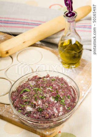 fresh raw dough and beef forcemeat fresh raw dough and beef forcemeat 50165497