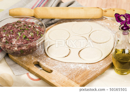 fresh raw dough and beef forcemeat fresh raw dough and beef forcemeat 50165501