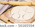 fresh raw dough and rolling pin 50165504
