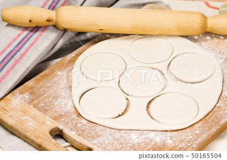 fresh raw dough and rolling pin fresh raw dough and rolling pin 50165504