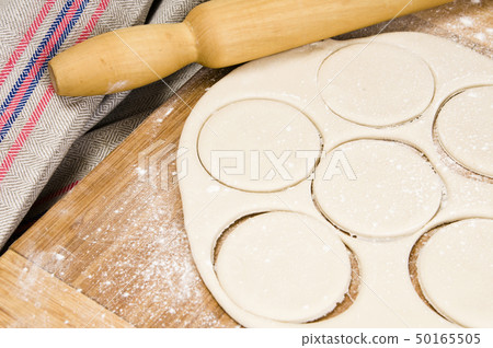 fresh raw dough and rolling pin fresh raw dough and rolling pin 50165505
