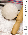 fresh raw dough and rolling pin 50165507