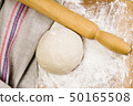 fresh raw dough and rolling pin 50165508