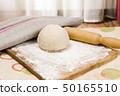 fresh raw dough and rolling pin 50165510