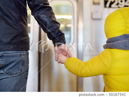 Mature man and his little son looks out the window Mature man and his little son looks out the window 50167341