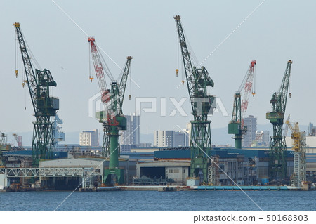 Kobe Port Cranes lined with shipyards 50168303