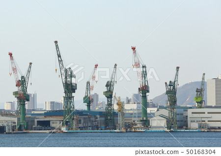 Kobe Port Cranes lined with shipyards Kobe Port Cranes lined with shipyards 50168304