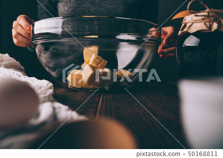 Woman's hands holding large transparent bowl Woman's hands holding large transparent bowl 50168811