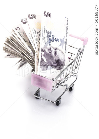 Turkish lira banknotes in a small trolley on white Turkish lira banknotes in a small trolley on white 50169377