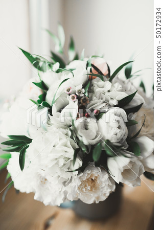Beautiful wedding bouquet with different flowers, roses Beautiful wedding bouquet with different flowers, roses 50172934