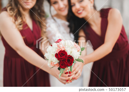 Bride holding big and beautiful wedding bouquet with flowers 50173057
