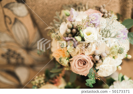 Beautiful wedding bouquet with different flowers, roses Beautiful wedding bouquet with different flowers, roses 50173371